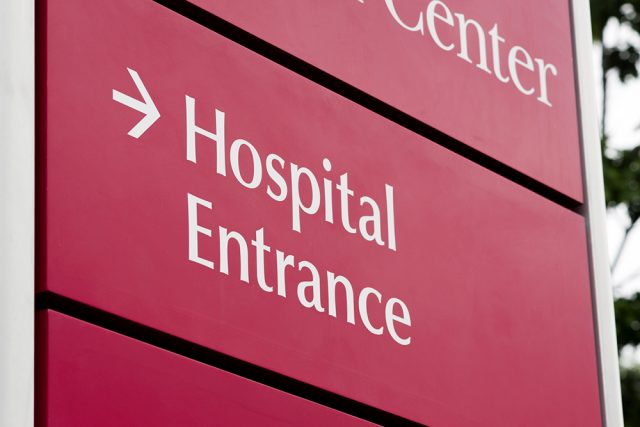 Up close view of hospital entrance sign