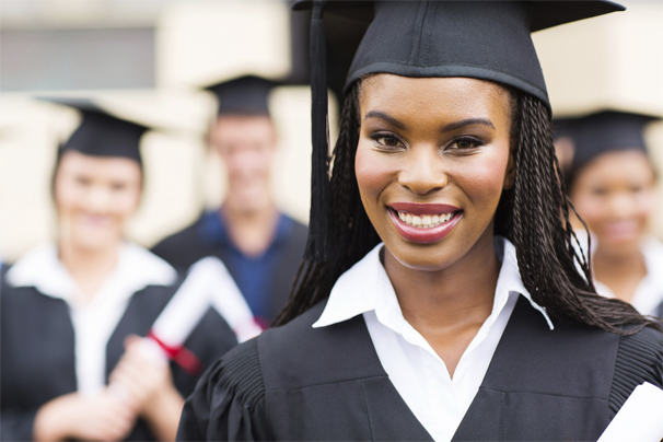close up portrait of african american female graduate in front of classmates