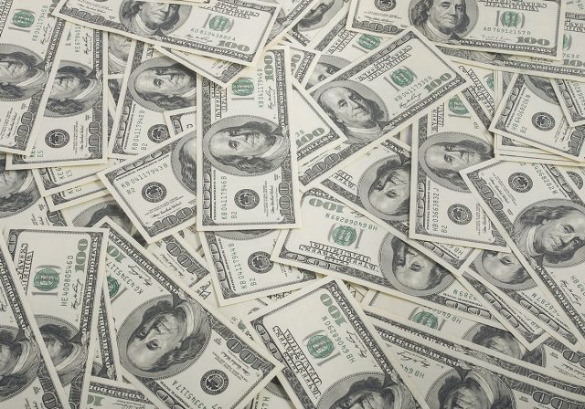 american dollars pile as background